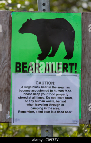 Sign posted near Portage warns of a bear sighting in the area, Southcentral Alaska, Spring Stock Photo