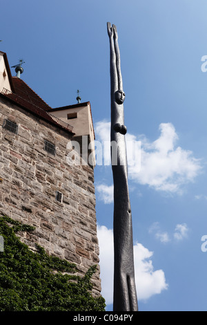 Female bronze figure of the Diver's Fountain by Gerhard Nerowski in front of Fehnturm Tower, Herzogenaurach, Middle Franconia Stock Photo