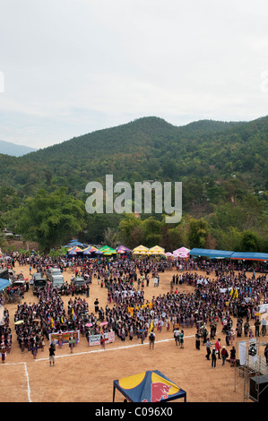 Hmong men and women take part in a new year festival parade at Hung Saew village, Chiang Mai, Thailand. Stock Photo