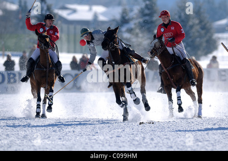 Polo players battling for the ball, Matias Maiquez of Team Drettmann Group, chased by Marty van Scherpenzeel, left, and Jack Stock Photo