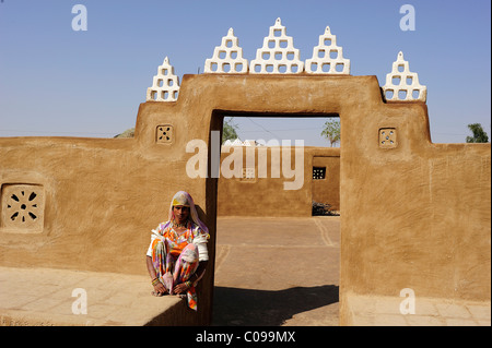Young woman at the entrance to a courtyard, Thar Desert, Rajasthan, North India, India, Asia