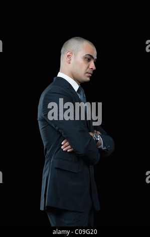 Side profile of a businessman thinking Stock Photo