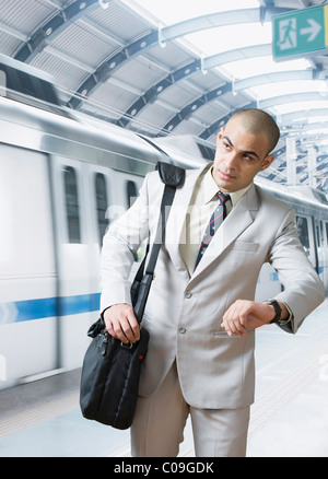 Businessman checking the time Stock Photo