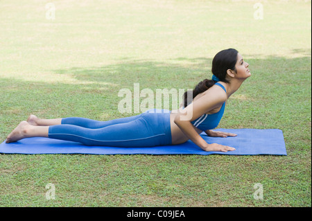 Woman doing Surya Namaskar (Sun Slautation) Stock Photo