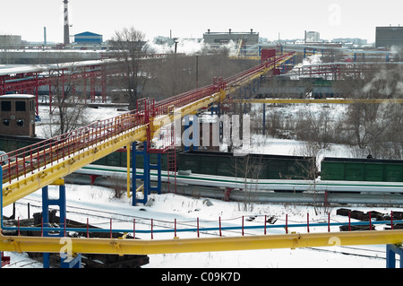 Above-ground pipe rack industrial piping at the plant in Russia. Heat pipeline Stock Photo