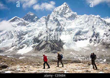 Trekkers with Mount Everest and Nuptse from Kala Patthar, Khumbu region, Himalaya Mountains, Nepal. Stock Photo