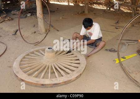 Wheelwright's workshop, production of wooden spoke wheels in a village near Bagan, Myanmar, Burma, Southeast Asia, Asia Stock Photo