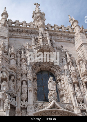 Door of stone carvings atop a door of Jeronimos Monastery in Belem, Lisbon Stock Photo