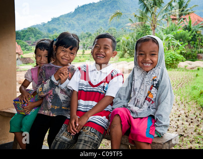 Smiling and happy Balinese children from a village in east Bali called Sideman. Stock Photo