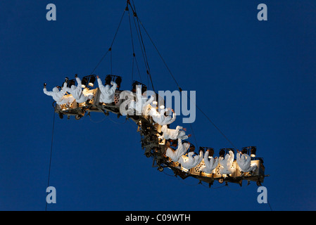 White-clad trapeze artists hanging upside down from a waved platform in the air, Global Rheingold, open-air theater by La Fura Stock Photo