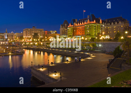 Illuminated Victoria's Inner Harbour with the landmark Empress Hotel (Fairmont Hotel) in the background at twilight, Victoria, Stock Photo