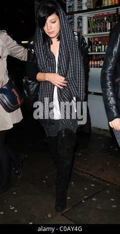 Lily Allen leaving the Boston Arms Bar keeping warm with a scarf draped ...