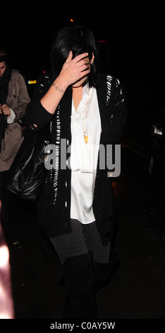 Lily Allen leaving the Boston Arms Bar keeping warm with a scarf draped ...