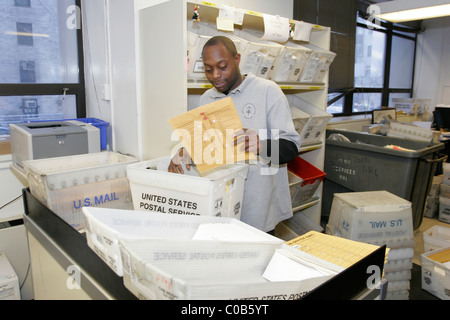 Workers in the mail room at a major New York City Hospital. Stock Photo