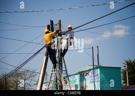 Electricians at work in a village in Yucatan, Mexico Stock Photo