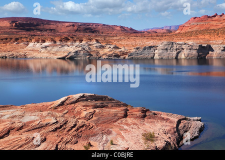 Antelope Canyon with a smooth blue water in the Navajo Reservation. Midday summer silence Stock Photo