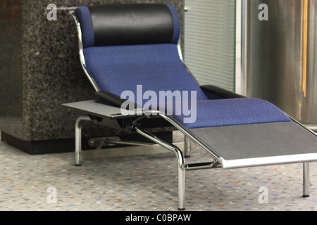 Airport reclined seating in Hong Kong International Airport Stock Photo