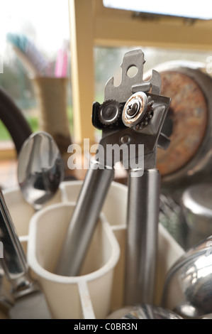 close up of cutlery in a drainer next to kitchen sink Stock Photo