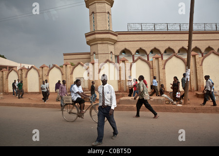 Pedestrians walk along the streets outside the great mosque in Lilongwe, Malawi, East Africa. Stock Photo