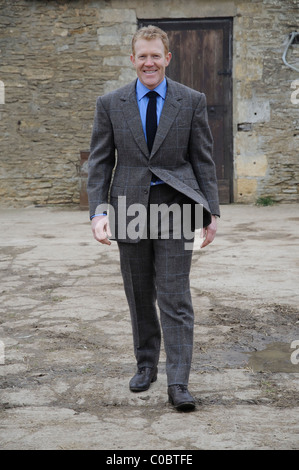 Adam Henson Cotswold farmer and tv presenter on his farm wearing a bespoke Savile Row tailored suit Stock Photo