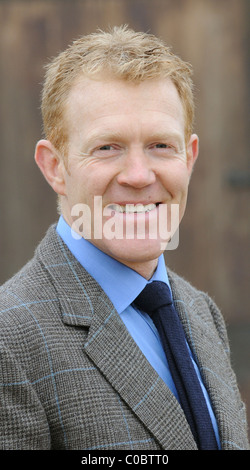 Adam Henson Cotswold farmer and tv presenter on his farm wearing a bespoke Savile Row tailored suit Stock Photo