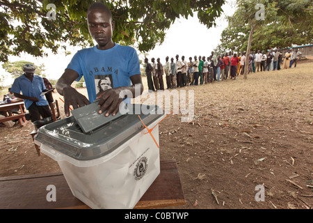 A Ugandan voter casts his ballot in the 2011 Presidential election at a polling station in Soroti, Uganda, East Africa. Stock Photo