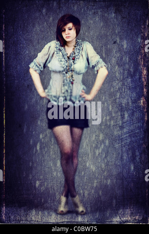 Young female with her hand on her hips Stock Photo