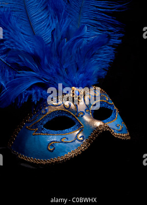 A blue masquerade mask on black background Stock Photo