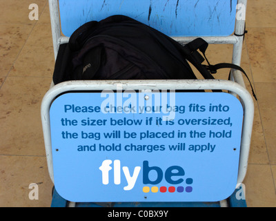 oversized bag in flybe cabin baggage size gauge at airport Stock Photo