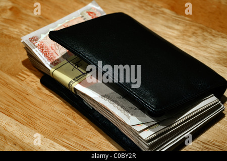 Wad of £50 notes in wallet, London, England, UK, Europe Stock Photo