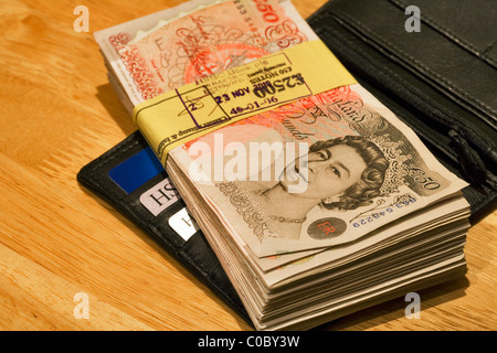 Wad of £50 notes in wallet, London, England, UK, Europe Stock Photo