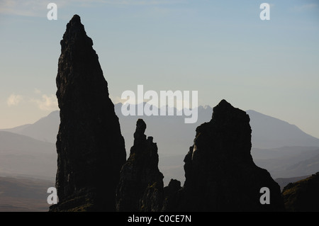 Close up silhouette of the Old Man of Storr, with the Cuillin mountains in the background, Isle of Skye Stock Photo
