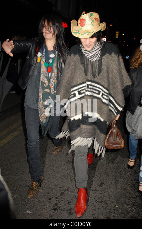 Noel Fielding and Alison Mosshart from The Kills leave the 'Nobby Clark Shoots Noel Fielding - private view' held at Maison Stock Photo