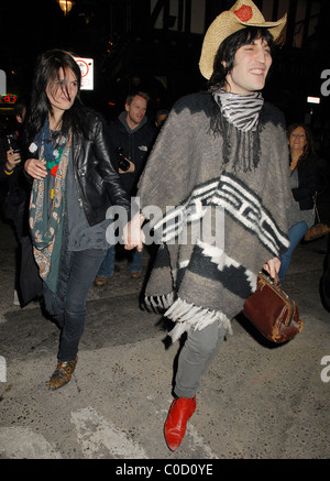 Noel Fielding and Alison Mosshart from The Kills leave the 'Nobby Clark Shoots Noel Fielding - private view' held at Maison Stock Photo