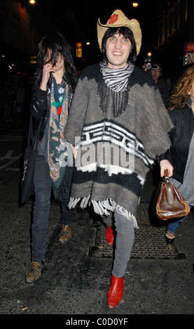 Noel Fielding and Alison Mosshart from The Kills leave the 'Nobby Clark Shoots Noel Fielding - private view' held at Maison Stock Photo