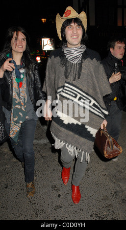 Noel Fielding and Alison Mosshart from The Kills leave the 'Nobby Clark Shoots Noel Fielding - private view' held at Maison Stock Photo