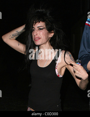 Amy Winehouse goes on another late night bender in Camden visiting the same pub, 'The Good Mixer' as the night before. She Stock Photo