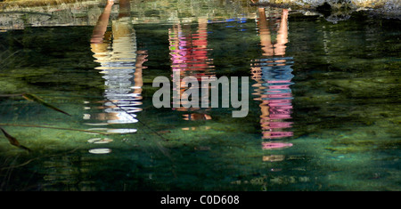 people reflected in waters of Ichetucknee Springs State Park North Florida Stock Photo