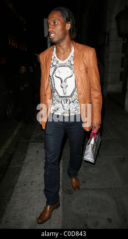 Didier Drogba, Chelsea and Ivory Coast striker leaving Nobu Berkeley Street restaurant, carrying a Yves Saint Laurent bag. Stock Photo