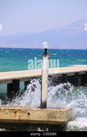 Wave breaking on pier in Turkey Stock Photo