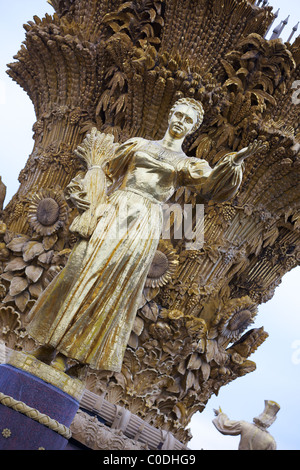 A gilded Russian maiden on the Fountain of the Friendship of Peoples, the VVT, Moscow, Russia Stock Photo