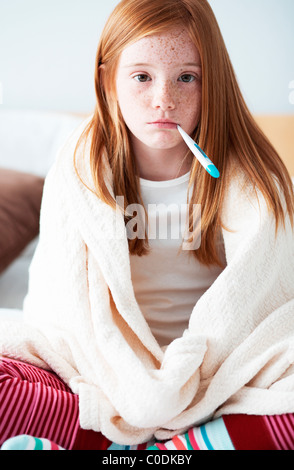 Sick girl with thermometer Stock Photo