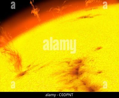 The turbulent surface of our Sun, showing prominences, sunspots and other features. Stock Photo