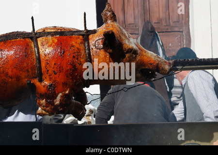 Whole pig roasting on barbecue at Fiesta del Almendro in Tejeda, Gran Canaria, Canary Islands, Spain Stock Photo