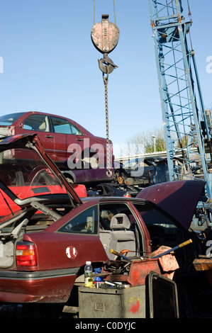 piles of cars and parts in a scrapyard Stock Photo