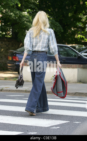 Claudia Schiffer walks her son to school in a pair of very large denim flares London, England - 13.05.08 Stock Photo