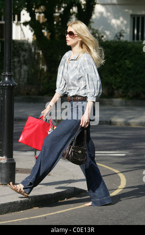 Claudia Schiffer walks her son to school in a pair of very large denim flares London, England - 13.05.08 Stock Photo