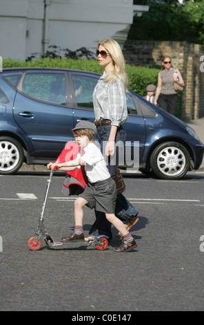 Claudia Schiffer walks her son Caspar to school in a pair of very large denim flares London, England - 13.05.08 Stock Photo