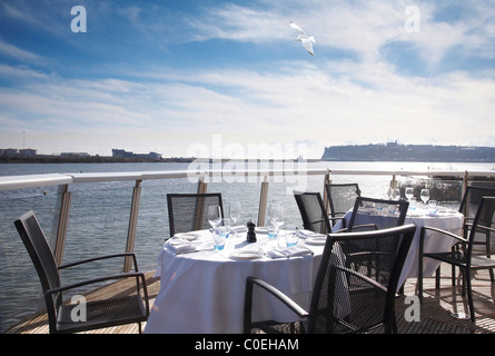 Table setting on a verandar at St David's hotel in Cardiff on a sunny day. Stock Photo
