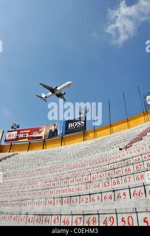 plane over arena Plaza de Toros Quito Ecuador South America Stock Photo